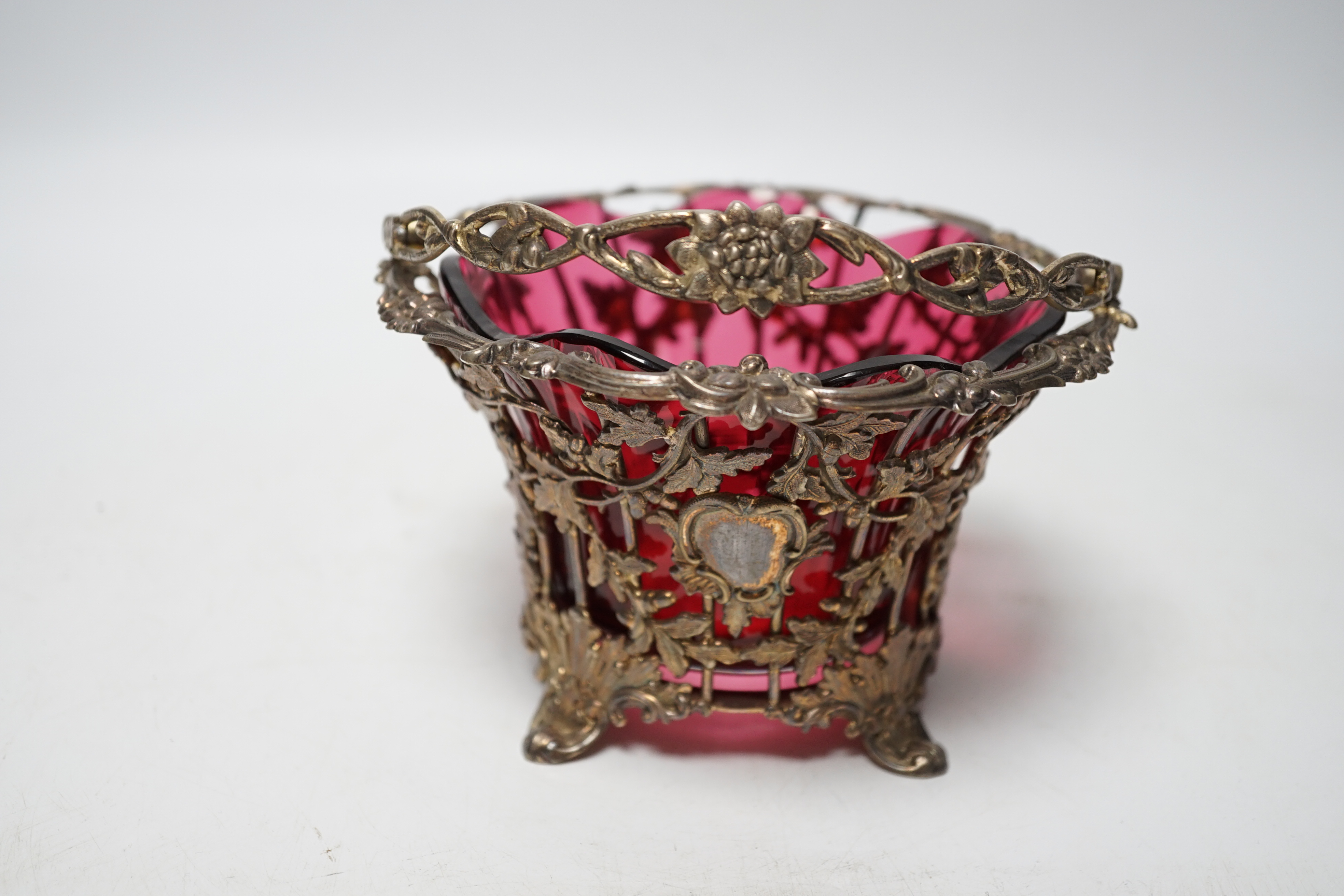 A Victorian pierced silver sugar basket, Hawksworth, Eyre & Co, Sheffield, 1842, with cranberry glass liner, diameter 13.7cm.